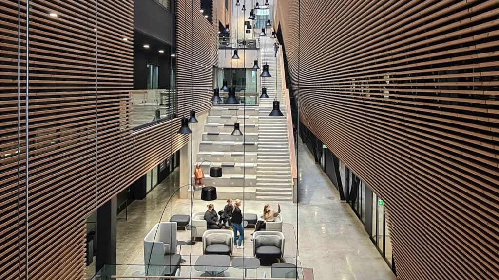 Exterior Hospitality Sector Facades Lunawood ThermowoodAurum beautiful accoustic atrium with battens b